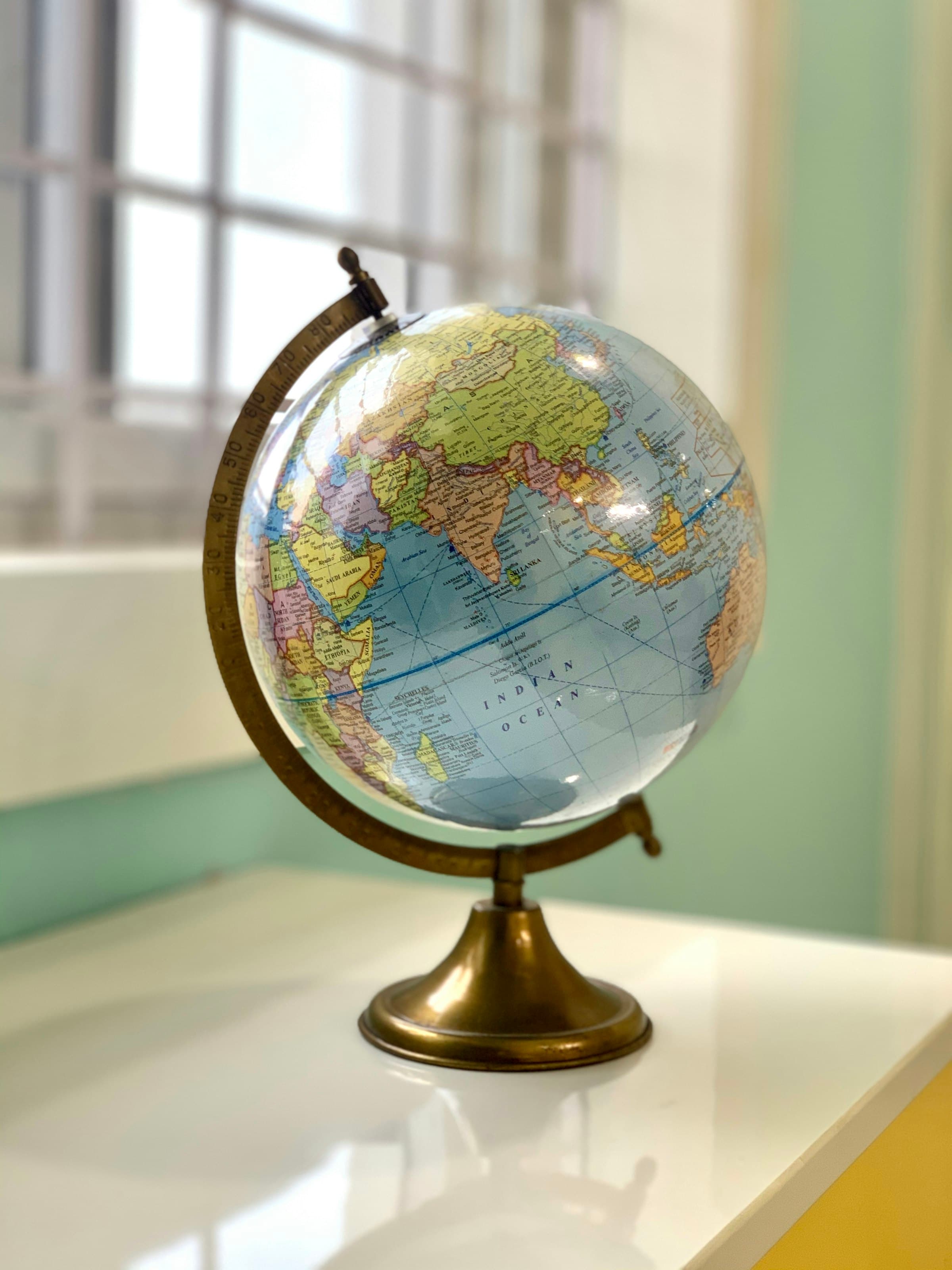 A desk globe representing worldwide reach